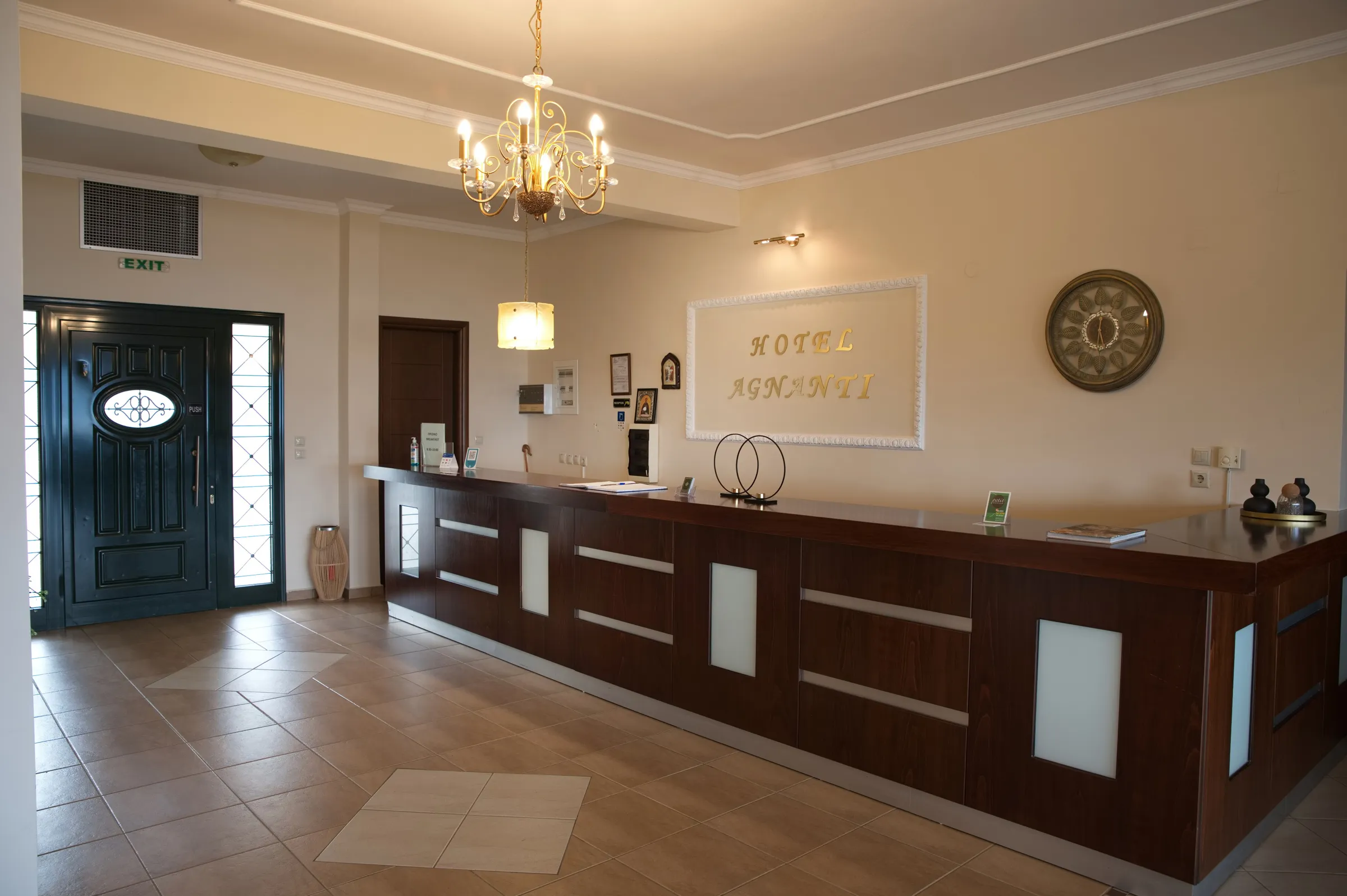 realistic photo of a reception hall of a hotel with a wooden modern reception desk
