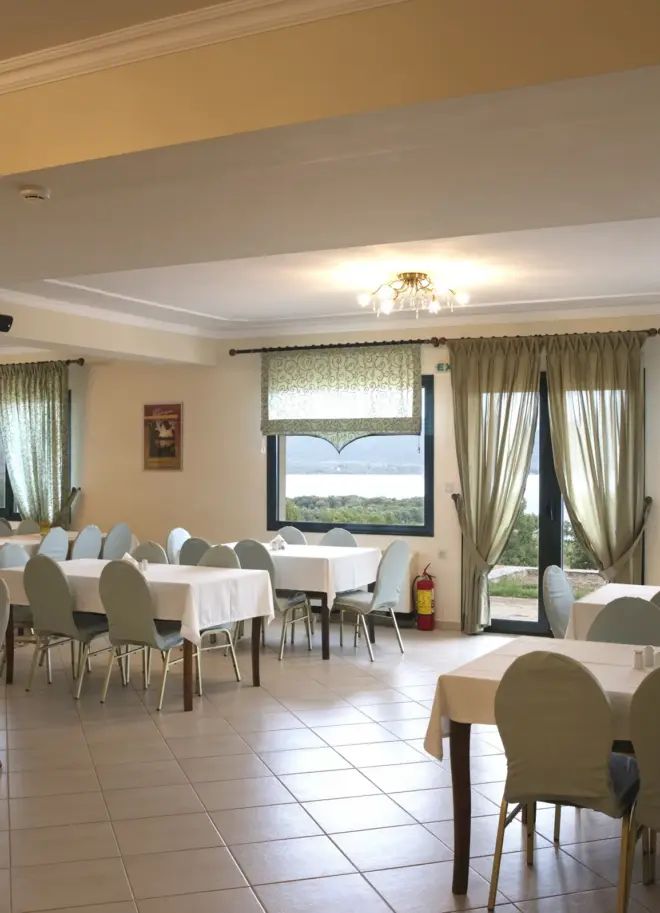 inside view of the dining area with large tables and ambient lighting