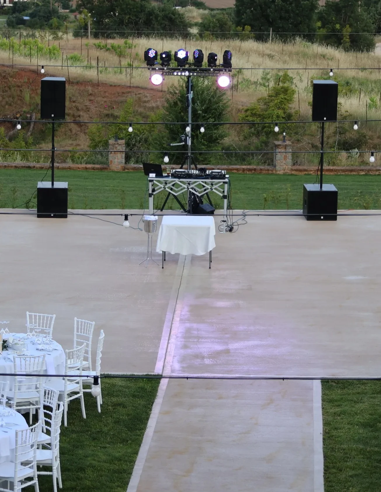aerial view of the wedding space in the hotel yard featuring the main dancefloor area and the wedding table