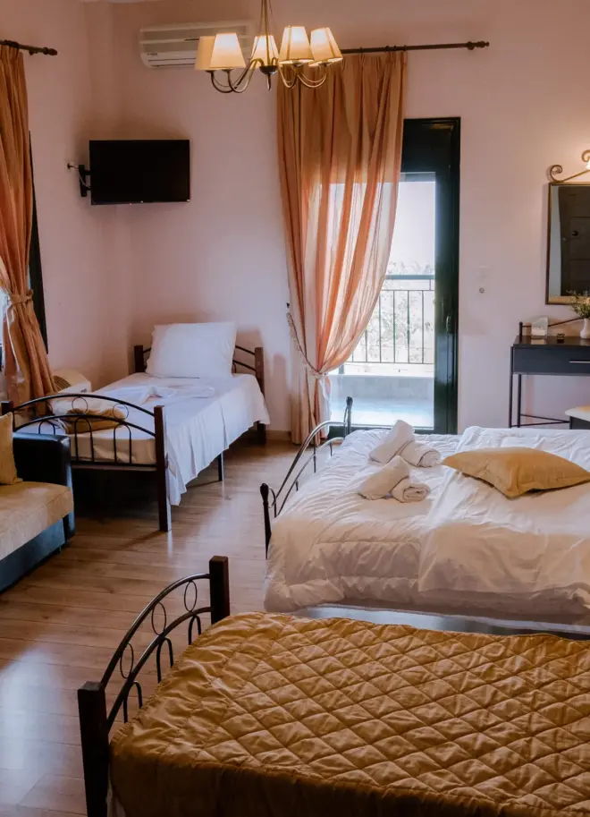 realistic photo from above of a hotel room featuring one double bed and 2 single beds with luxury design