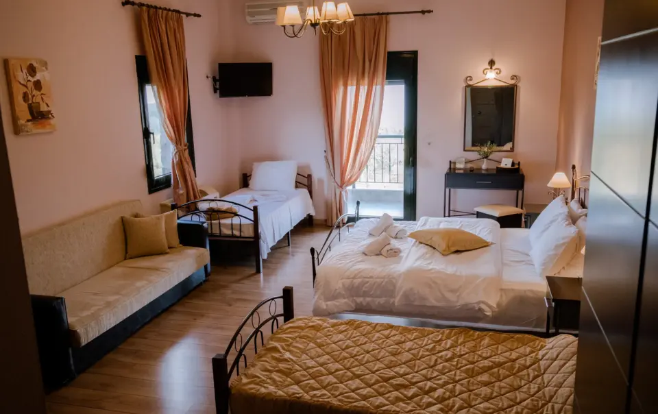 realistic photo from above of a hotel room featuring one double bed and 2 single beds with luxury design